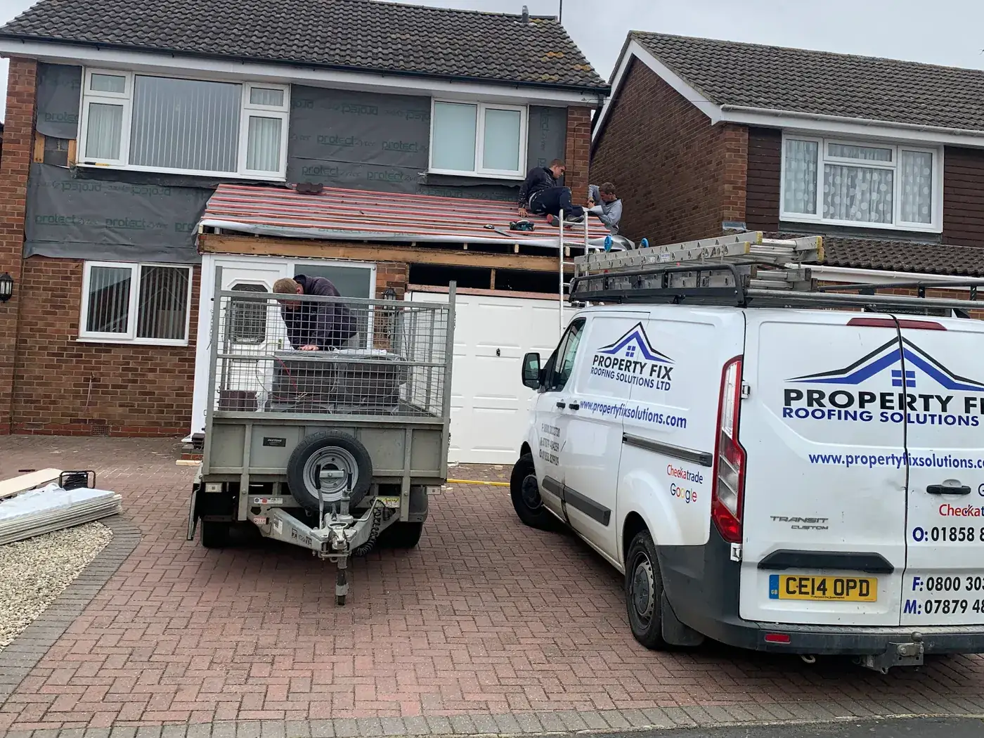 The Property Fix Roofing Solutions Ltd van and trailer outside a roof replacement in progress